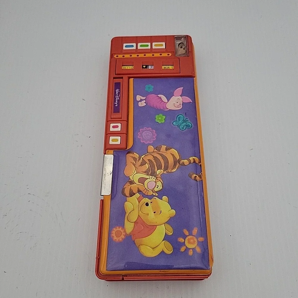 Walt Disney Winnie the Pooh Pencil Case Push Button Popup Sharpener Calendar vtg